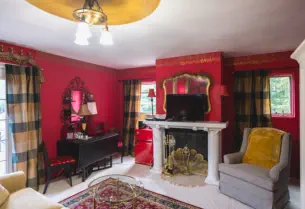 richly decorated vacation rental with mini fridge, microwave and tv