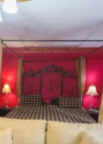 fancy bad in richly decorated room