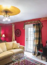room with door to balcony and small breakfast table