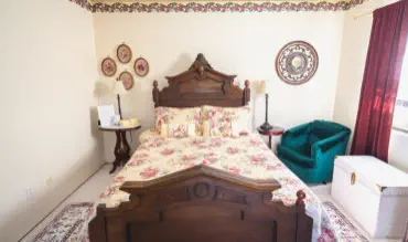 queen bed in victorian themed weekend escape