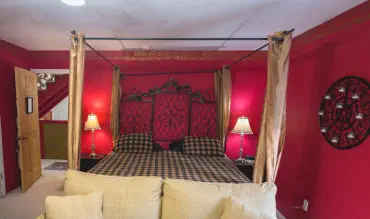 fancy bad in richly decorated room
