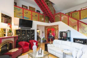 asian decorations in living room and on stair railings