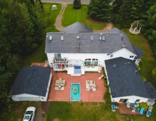 aerial view of ivory mansion from back of house
