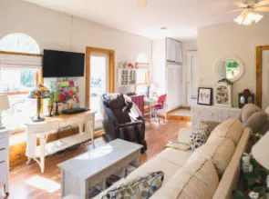 tv massage chair and door to patio in living room of suite